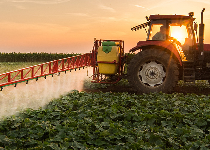 tractor spraying a field